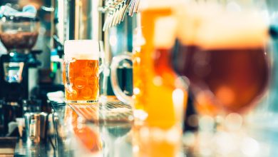 bartender pouring beer into glass