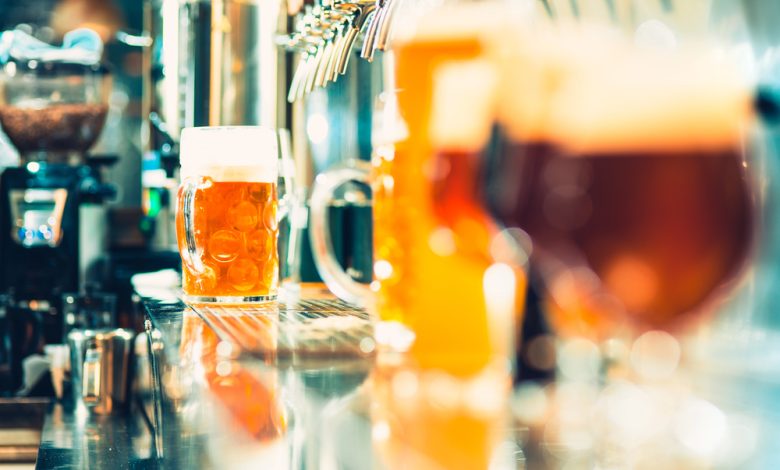 bartender pouring beer into glass