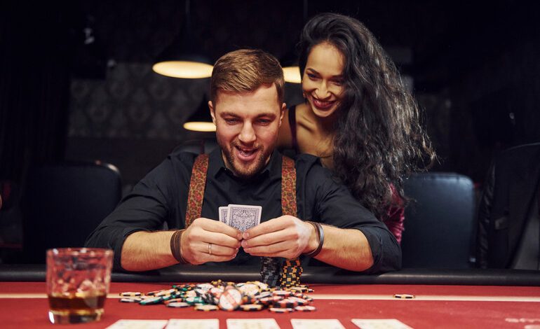 A happy couple exploring casino bonus offers