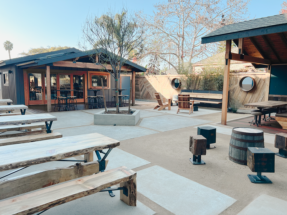 Exterior shot of backyard at Docent Brewing's Carlsbad Village taproom, The Cottage