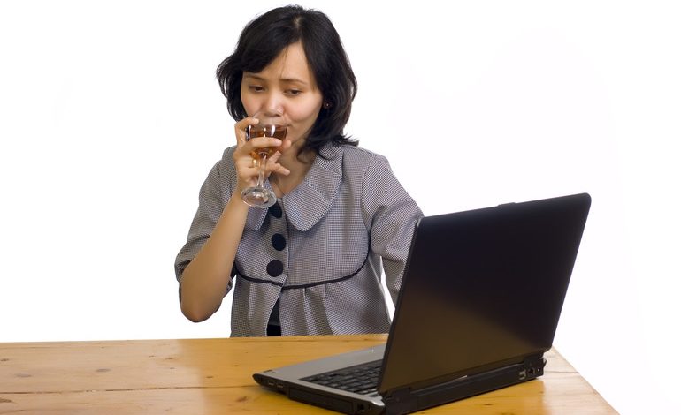 A girl watching free YouTube videos and enjoying beer