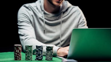 Young man playing online casino games on his laptop