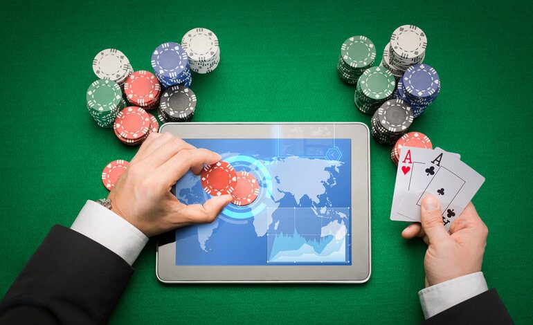 Casino poker player with cards, tablet, and chips, representing gambling trends in Thailand