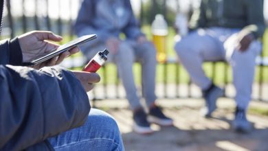 A person enjoying a THCA vape during a relaxing moment