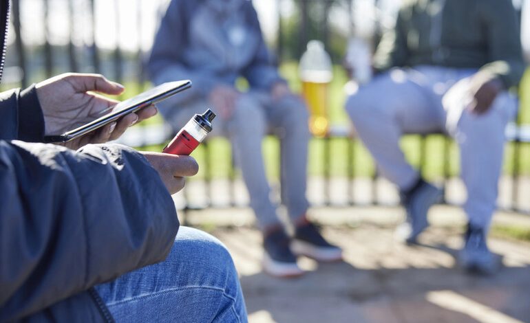 A person enjoying a THCA vape during a relaxing moment