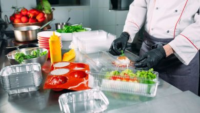 Chef organizing prep stations in a bustling kitchen, illustrating key strategies for the organized food service industry