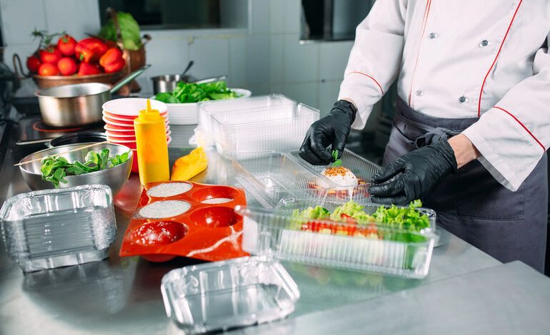 Chef organizing prep stations in a bustling kitchen, illustrating key strategies for the organized food service industry