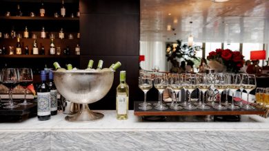 A beautiful restaurant bar setup with beer bottles and glasses