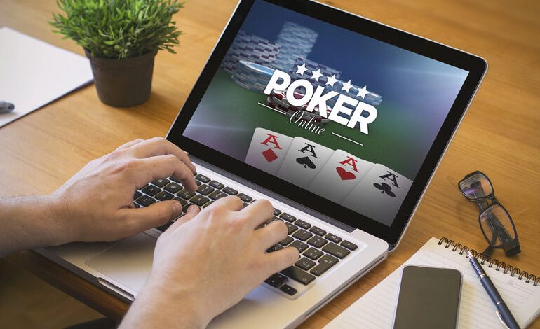 Man playing poker on a laptop