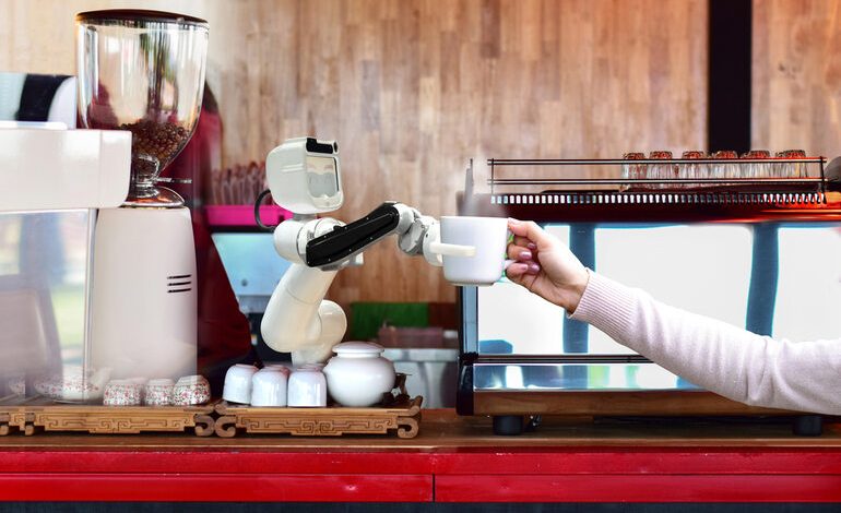 A robot serving hot coffee to people at work