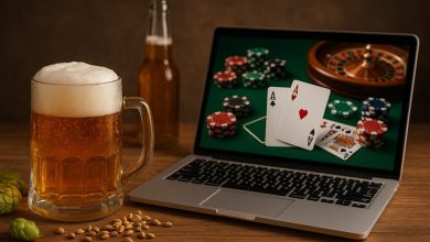 A player is enjoying a glass of beer while playing an online casino game