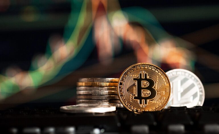 Bitcoin cryptocurrency in front of a blurred investment chart