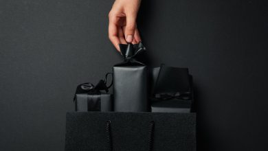 Elegant black packaging with ribbon details highlighting why packaging design is a game-changer for small brands