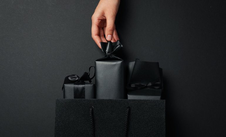 Elegant black packaging with ribbon details highlighting why packaging design is a game-changer for small brands