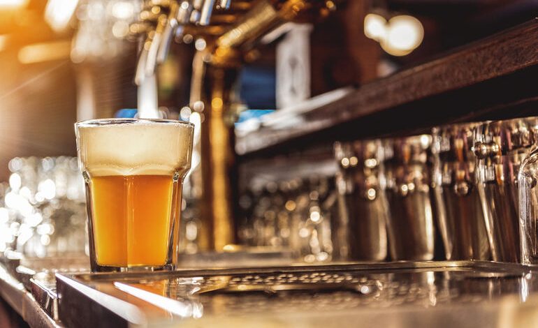 Freshly poured craft beer on tap at a San Diego brewery bar, showcasing the city’s vibrant beer culture