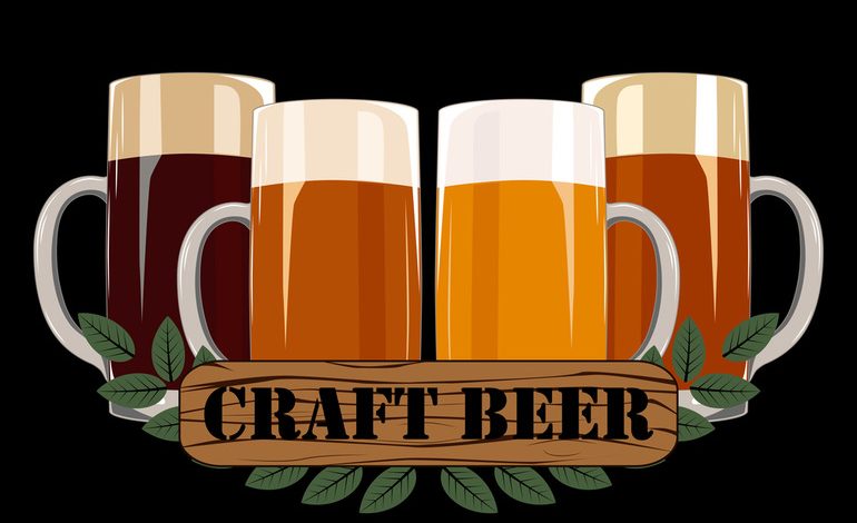 Four beer mugs with frothy tops and a wooden "Craft Beer" label
