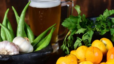 Fresh tropical vegetables and herbs with a cold craft beer