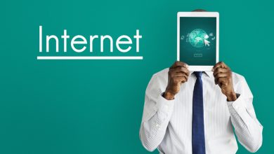 Businessman holding the tablet in front of his face with "Internet" text, rising use of PWAs over native apps in low-cost internet regions like Zambia