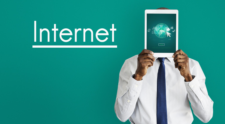 Businessman holding the tablet in front of his face with "Internet" text, rising use of PWAs over native apps in low-cost internet regions like Zambia