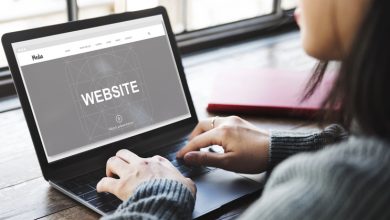 Person working on website development on a laptop, symbolizing the use of headless CMS for global digital rebranding