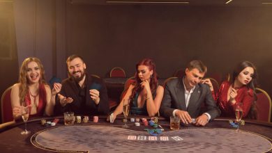 Group of stylish people playing poker at a casino table, enjoying drinks and the thrill of a live dealer game experience