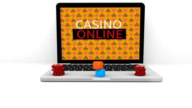 Laptop displaying “Casino Online” with poker chips and dice