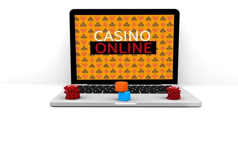 Laptop displaying “Casino Online” with poker chips and dice