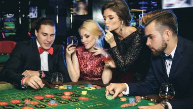 Elegant group of people playing roulette at a casino table