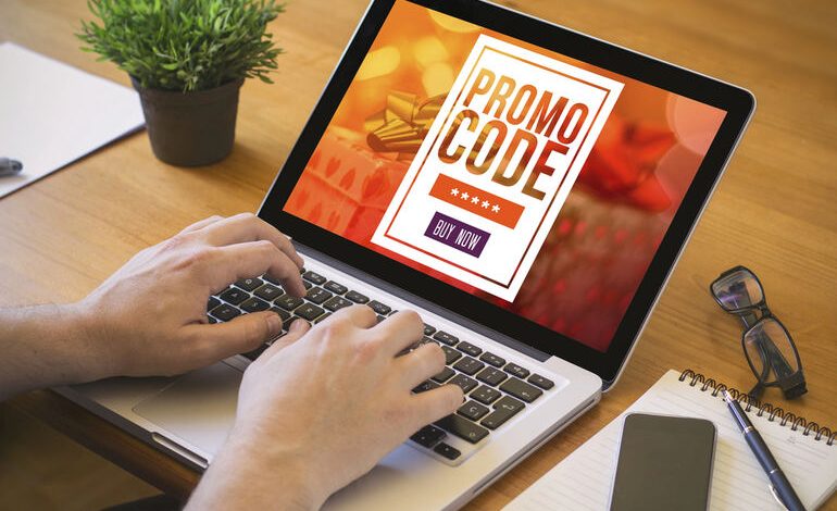 Person using a laptop with a screen displaying a promotional code offer