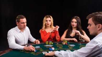Players at a live casino table in Canada are enjoying cards, chips, and real dealer action