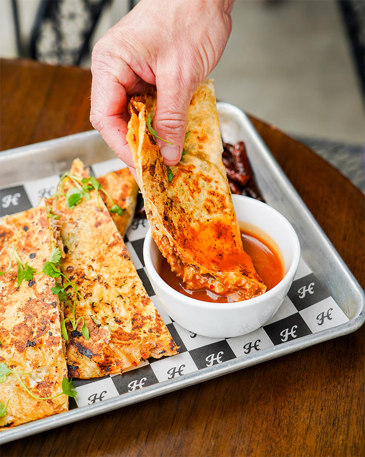 Birria quesadilla with chili de arbol consomme