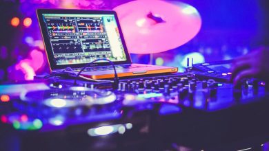 DJ mixing live at a vibrant rave-style beer event in San Diego