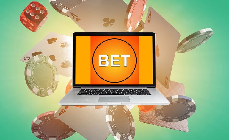 User typing on a laptop with a BET displayed on screen