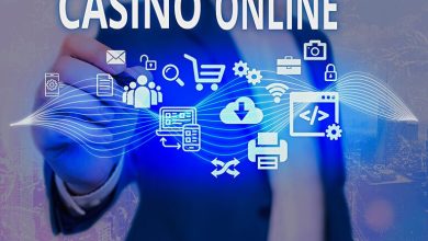 Businessperson pointing at virtual icons with the text ‘Casino Online’ on a digital interface.