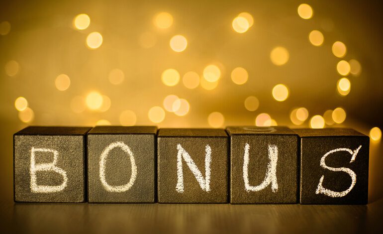 Bonus cubes with glowing golden lights promoting BitStarz's 125% deposit bonus and 210 free spins using code HELLA.