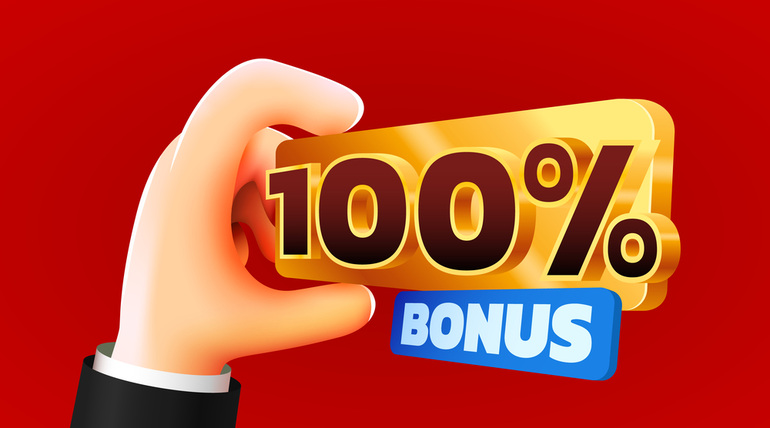 hand holding a shiny gold ‘100% bonus’ sign against a red background, representing online casino bonuses and promotional offers.