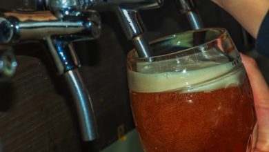 Full glass of beer at a San Diego event, highlighting responsible drinking and post-event safety efforts.