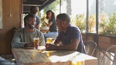 Fans celebrating with beer at a bar in Uganda