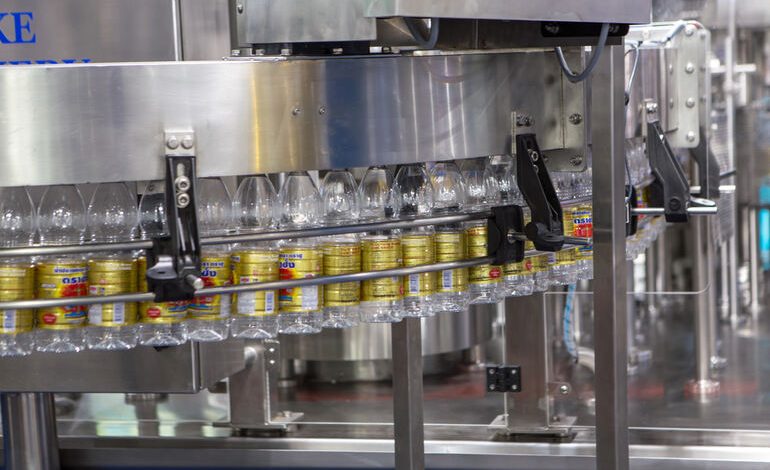 Automated filling machine: Factory production line.