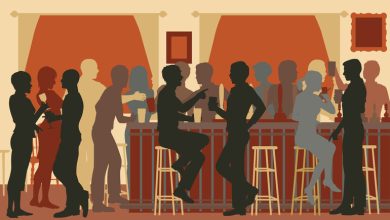 A group of people hanging out in a beer bar.