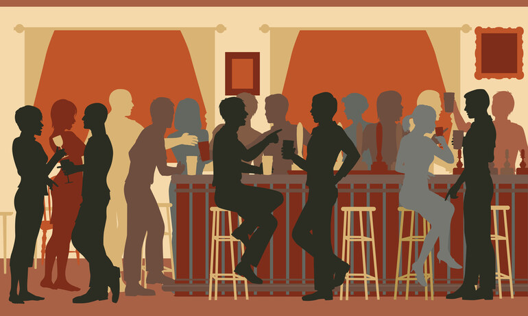 A group of people hanging out in a beer bar.