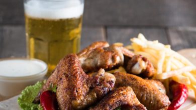 Crispy chicken wings, dipping sauce, fries, and a glass of beer are ideal during festivals and beer party events.