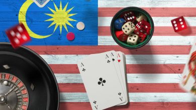 Cards and dice on a Malaysian flag.