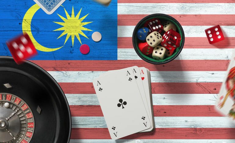 Cards and dice on a Malaysian flag.