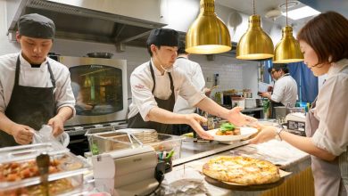 The photo was taken in one of the restaurant kitchens, where staff cook food during a busy service.
