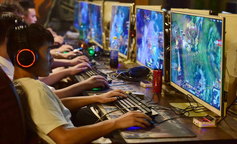 Esports players competing in a Southeast Asian gaming arena, highlighting the rise of competitive gaming culture popular among Filipino gamers.