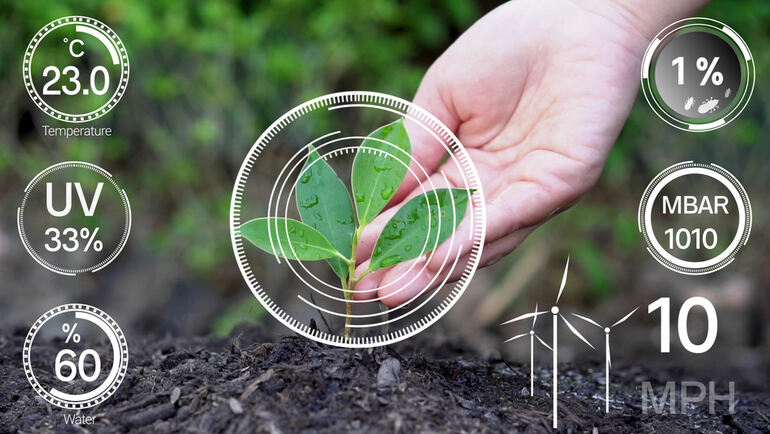 Hand nurturing a small green plant with soil, surrounded by AI-powered environmental data overlays including temperature, UV, moisture, pressure, and wind indicators.