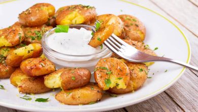 Crispy smashed homegrown potatoes served as bar-style appetizers with dipping sauce.
