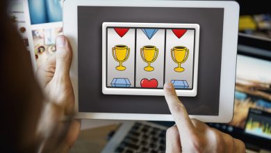 A man is playing an online slot game on a digital device