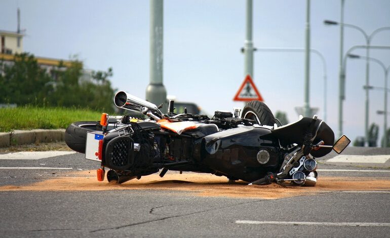 Motorcycle lying on its side after the road accident.